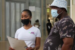 a man and a woman wearing face masks